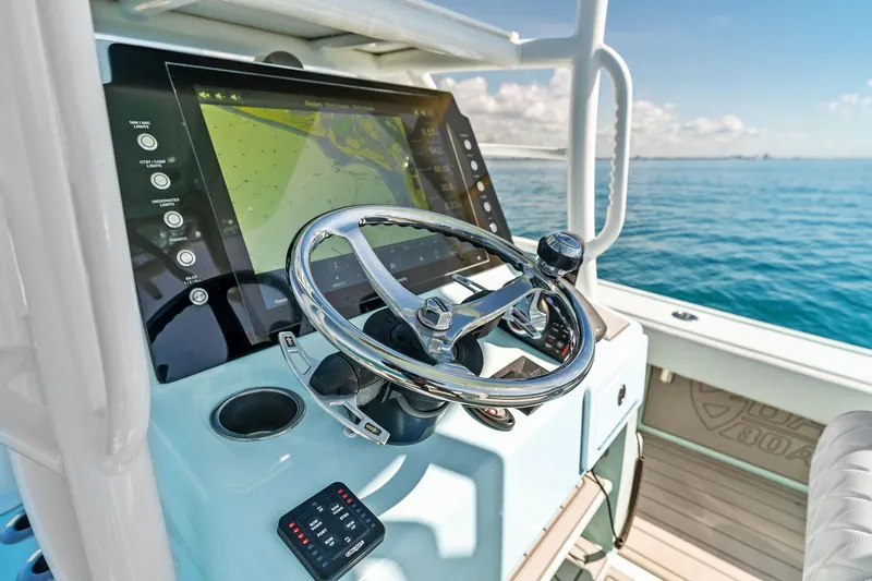 Slide: The Image of 2023 Barker Boatworks 26 Open helm with modern navigation system on open water. - 29