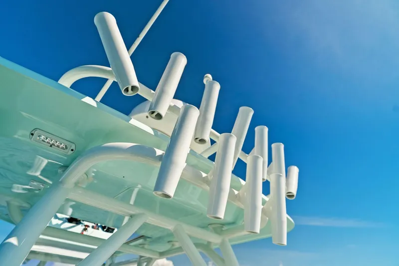 Slide: The Image of 2023 Barker Boatworks 26 Open rod holders against a clear blue sky. - 34