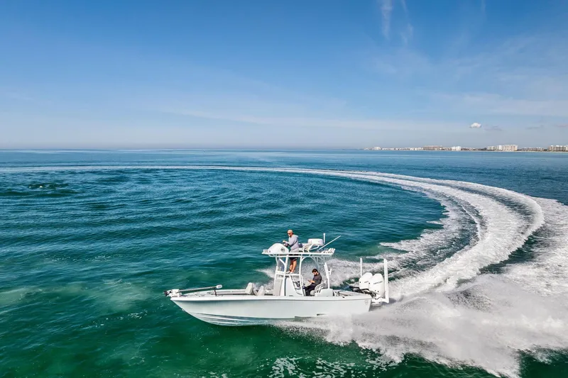 Slide: The Image of 2023 Barker Boatworks 26 Open cruising on clear blue ocean waters. - 43
