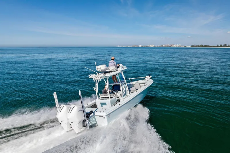 Slide: The Image of 2023 Barker Boatworks 26 Open cruising on open water, showcasing sleek design and performance. - 52