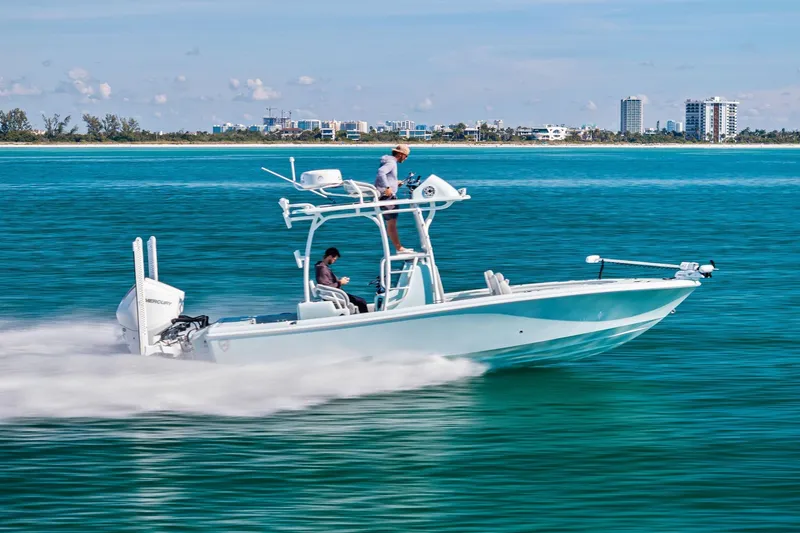 Slide: The Image of 2023 Barker Boatworks 26 Open cruising on clear blue water. - 54
