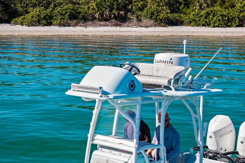 Slide: The Image of 2023 Barker Boatworks 26 Open on turquoise water near a sandy beach. - 9