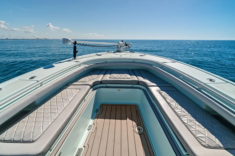 Slide: The Image of 2023 Barker Boatworks 26 Open on calm ocean, featuring spacious seating and sleek design. - 21