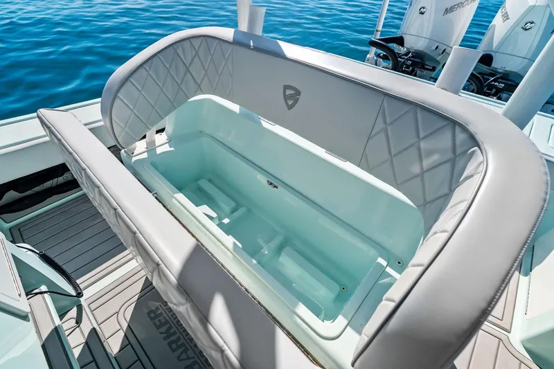Slide: The Image of 2023 Barker Boatworks 26 Open, featuring a spacious livewell on a sunny day. - 32