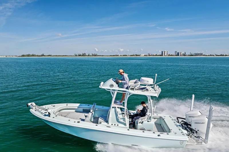 Slide: The Image of 2023 Barker Boatworks 26 Open cruising on clear blue water under a sunny sky. - 46