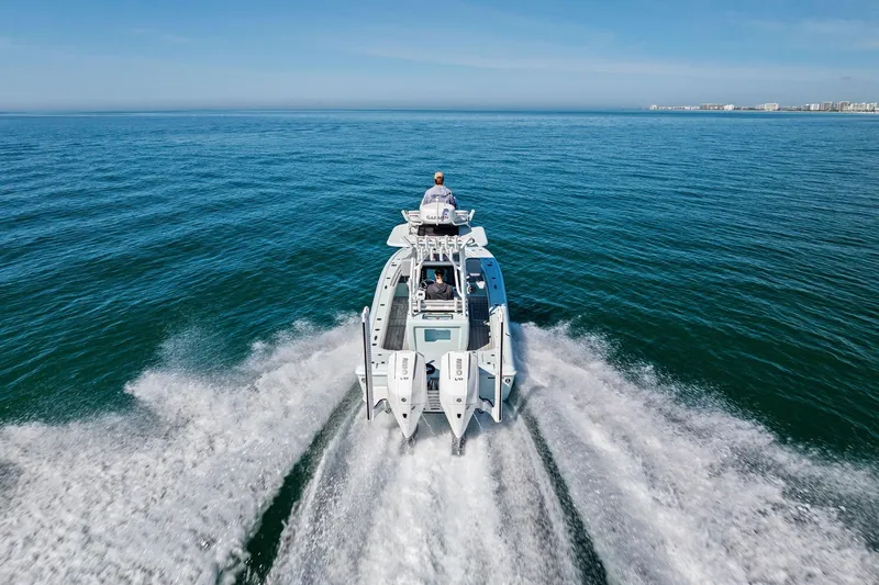 Slide: The Image of 2023 Barker Boatworks 26 Open cruising on open water, creating a dynamic wake. - 51