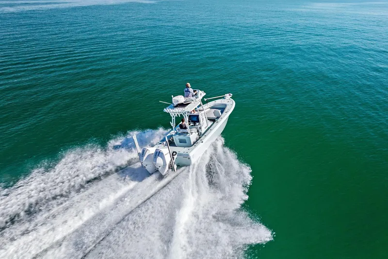 Slide: The Image of 2023 Barker Boatworks 26 Open cruising on clear blue water. - 60