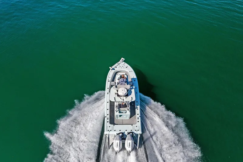 Slide: The Image of 2023 Barker Boatworks 26 Open cruising on clear green water, aerial view. - 63