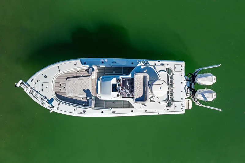 Slide: The Image of 2023 Barker Boatworks 26 Open, aerial view on green water. - 7