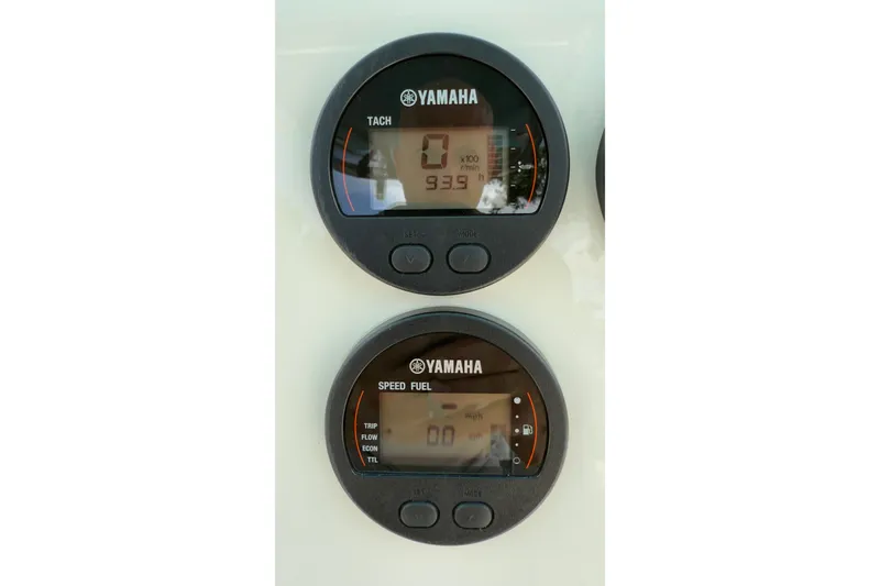 Slide: The Image of Yamaha digital gauges on 2023 Key West 219 FS boat dashboard. - 14