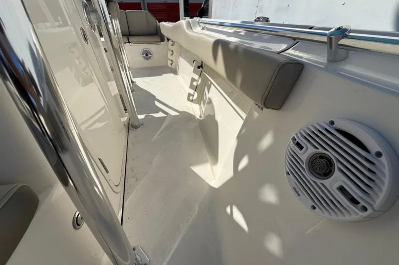 Slide: The Image of 2023 Key West 219 FS boat interior with seating and speaker system. - 23