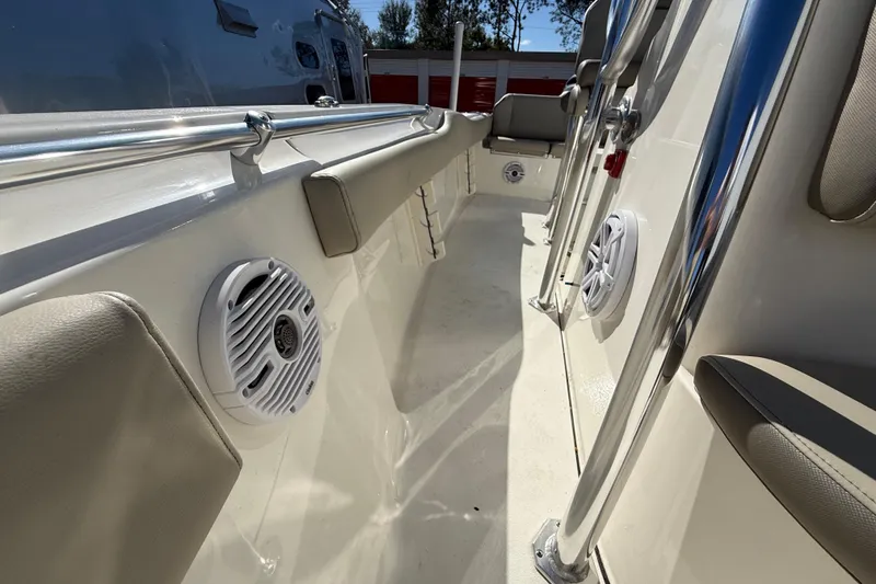 Slide: The Image of 2023 Key West 219 FS boat interior with speakers and seating. - 24