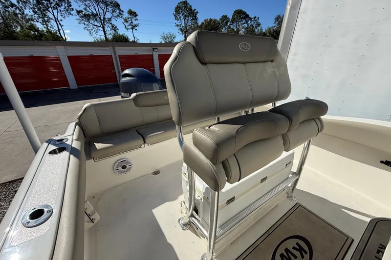 Slide: The Image of 2023 Key West 219 FS boat interior with cushioned seating and storage. - 26