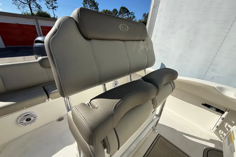 Slide: The Image of 2023 Key West 219 FS boat interior with cushioned seating and sleek design. - 27