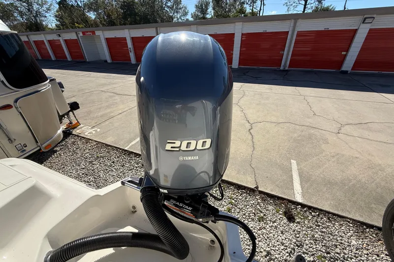 Slide: The Image of 2023 Key West 219 FS boat with Yamaha 200 outboard motor in storage area. - 30