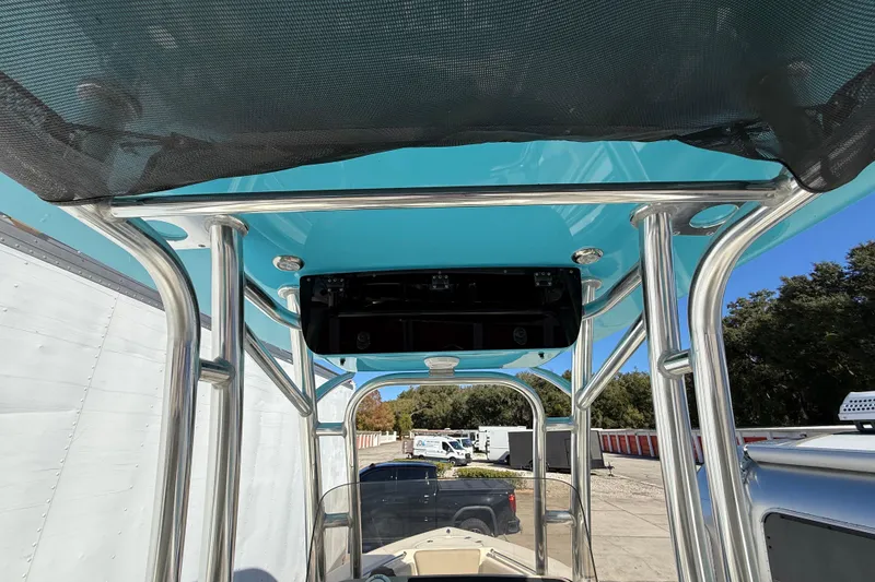 Slide: The Image of 2023 Key West 219 FS boat with blue T-top and stainless steel frame. - 33