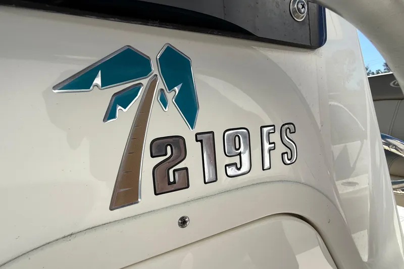 Slide: The Image of Key West 219 FS 2023 boat logo with palm tree design. - 40