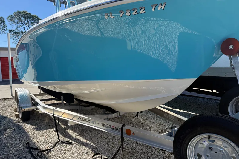 Slide: The Image of 2023 Key West 219 FS boat on trailer, blue hull, Florida registration. - 46