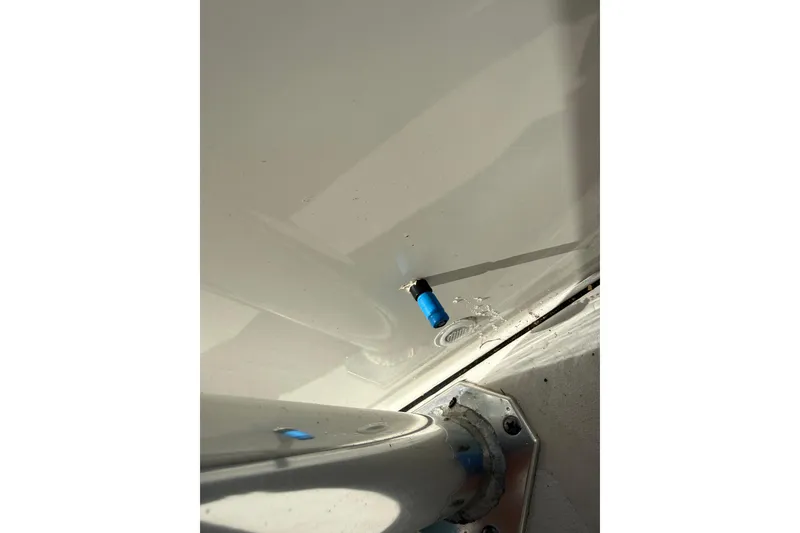 Slide: The Image of 2023 Key West 219 FS boat detail with blue fitting and metal base. - 56