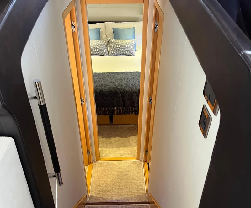 Slide: The Image of Interior view of a 2013 Prestige 500 S yacht bedroom with modern decor. - 11