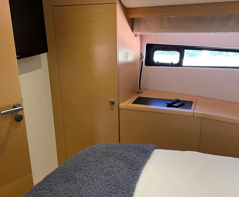 Slide: The Image of Luxurious interior of 2013 Prestige 500 S yacht cabin with modern wood finish. - 12
