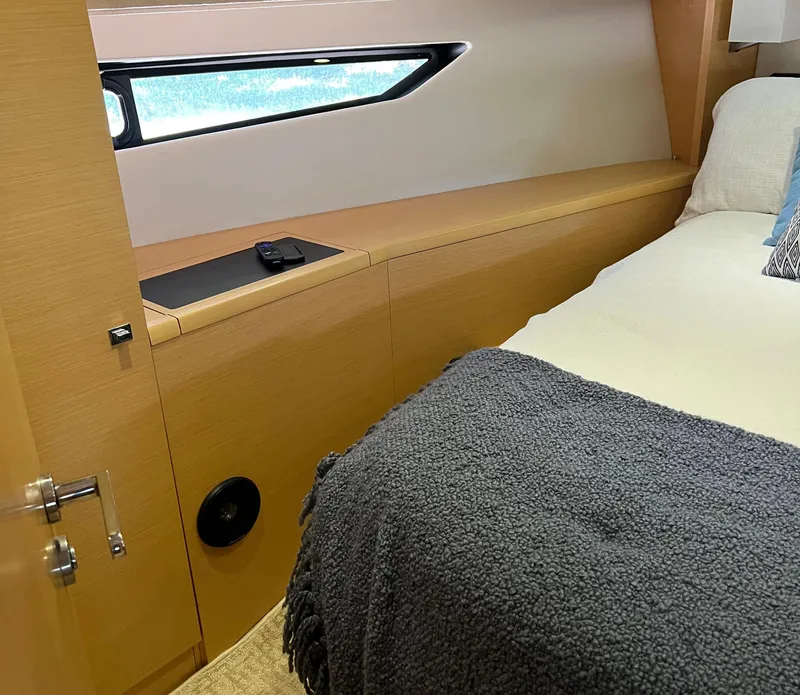 Slide: The Image of Cozy cabin interior of 2013 Prestige 500 S yacht with bed and window. - 13