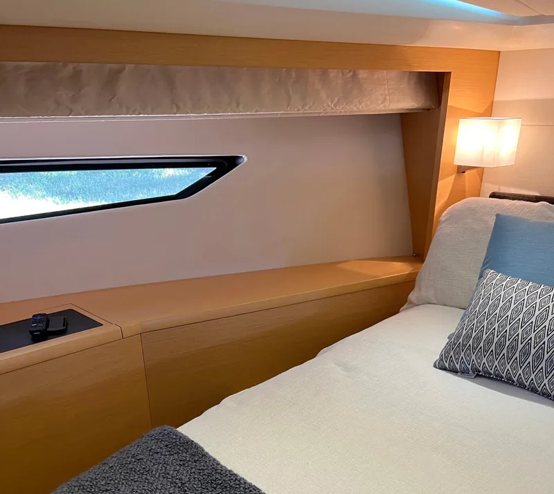 Slide: The Image of Luxurious cabin interior of 2013 Prestige 500 S yacht with modern decor and cozy bedding. - 14