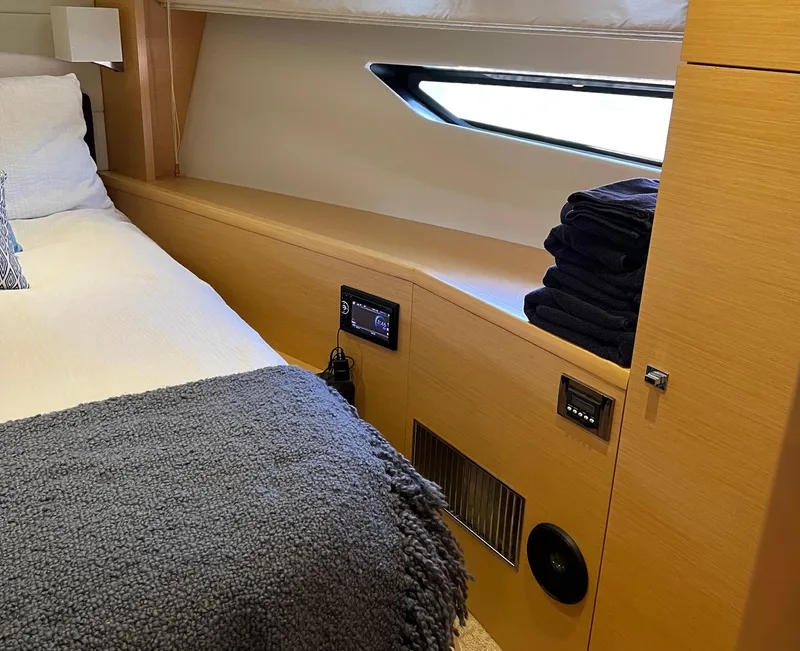 Slide: The Image of Cozy cabin interior of 2013 Prestige 500 S yacht with bed and window view. - 16