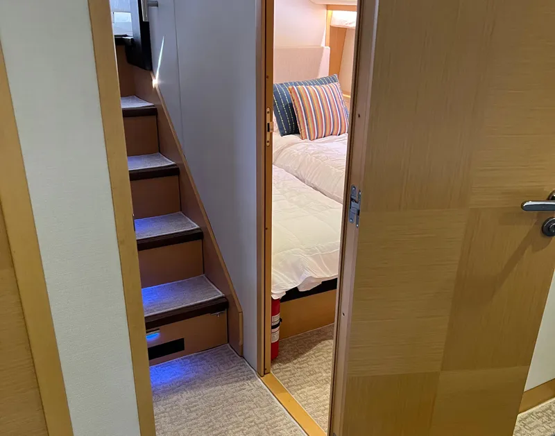 Slide: The Image of Interior of 2013 Prestige 500 S yacht showing stairs and cozy bedroom. - 17