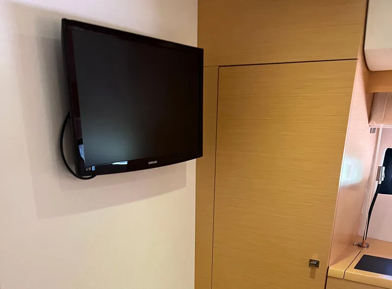 Slide: The Image of Wall-mounted TV in a 2013 Prestige 500 S yacht interior. - 21