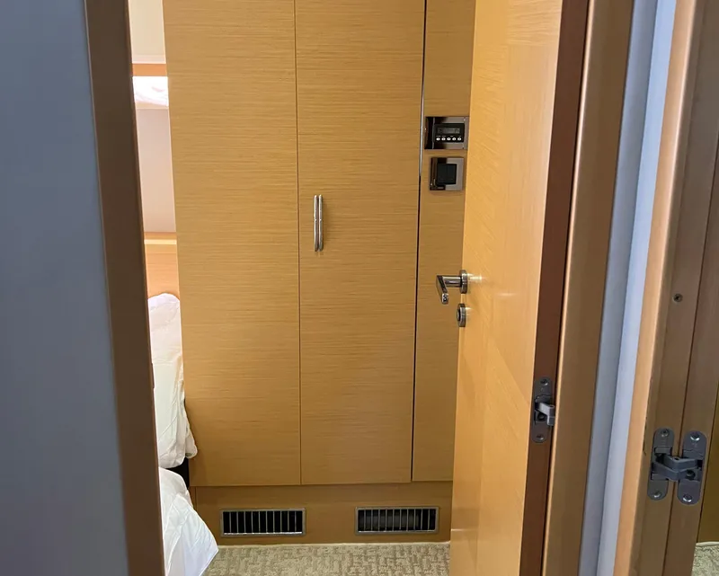 Slide: The Image of Interior of 2013 Prestige 500 S yacht showing wooden cabinetry and door. - 22