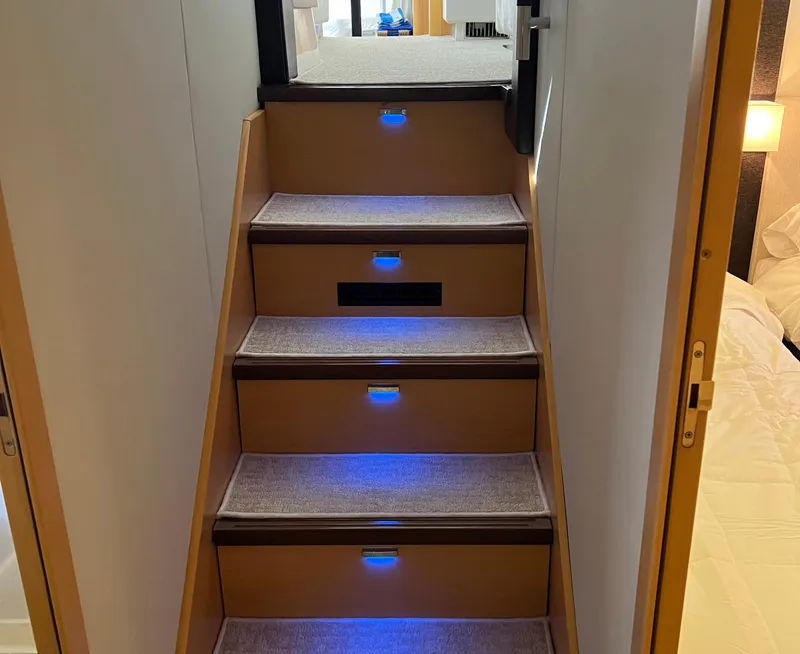 Slide: The Image of Staircase with blue LED lights inside 2013 Prestige 500 S yacht. - 26
