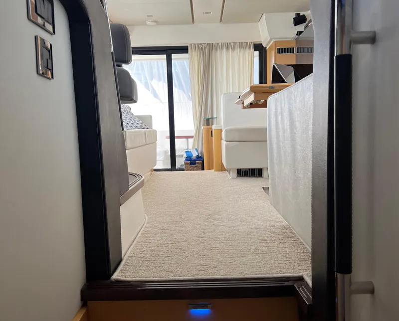 Slide: The Image of Interior view of a 2013 Prestige 500 S yacht, featuring modern seating and natural light. - 27