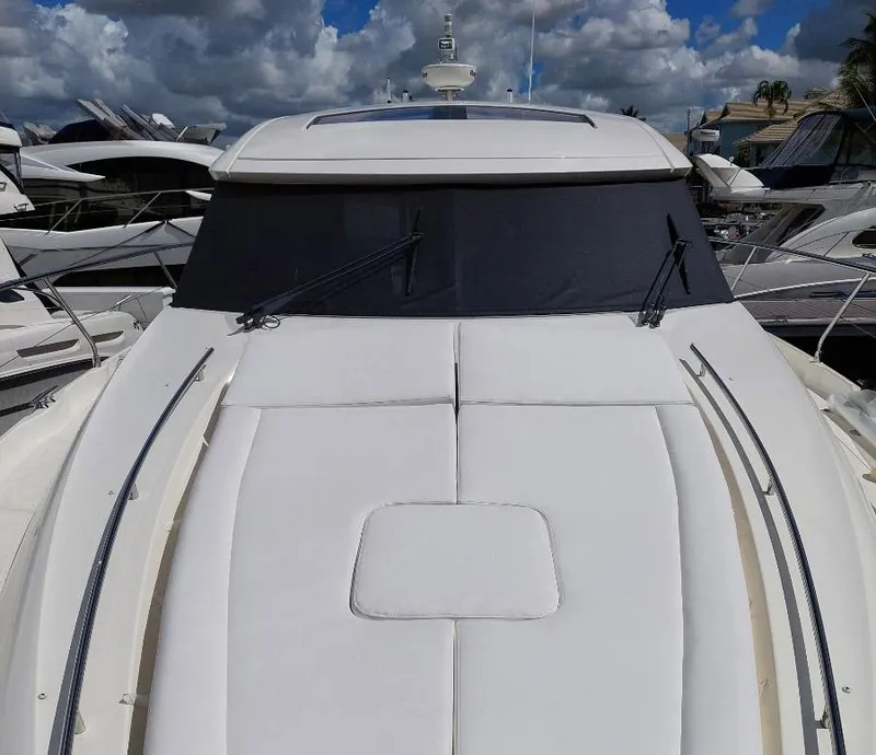 Slide: The Image of 2013 Prestige 500 S yacht with sleek design, docked under cloudy sky. - 28