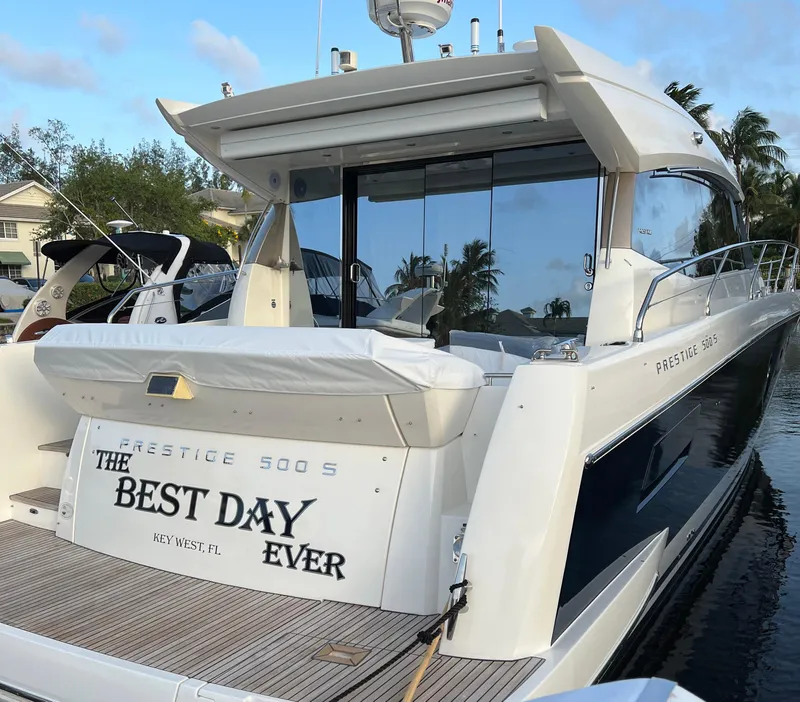 Slide: The Image of 2013 Prestige 500 S yacht docked, named "The Best Day Ever," in Key West, Florida. - 32