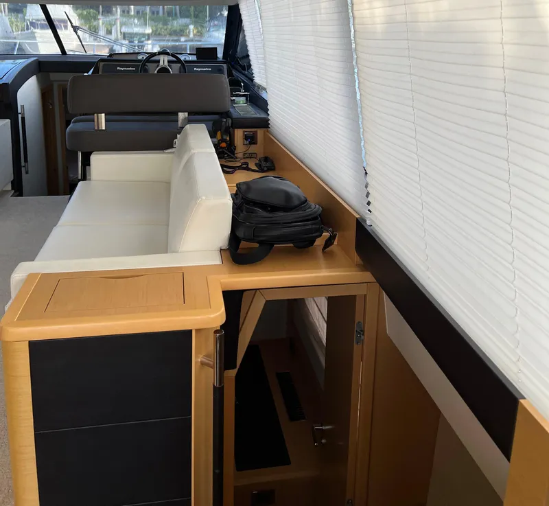 Slide: The Image of Interior of a 2013 Prestige 500 S yacht with seating and helm station. - 4