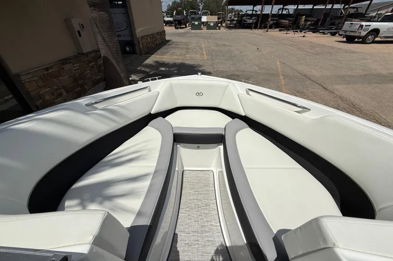 Slide: The Image of 2024 Cobalt 220S boat interior with white seating and sleek design. - 13