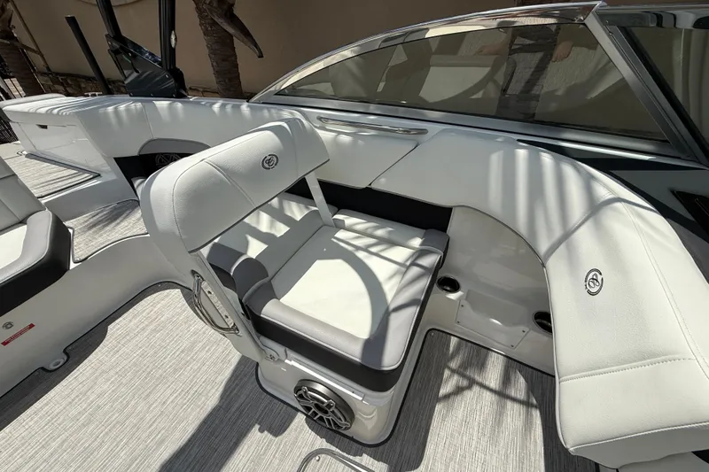 Slide: The Image of 2024 Cobalt 220S boat interior with white seating and modern design. - 14