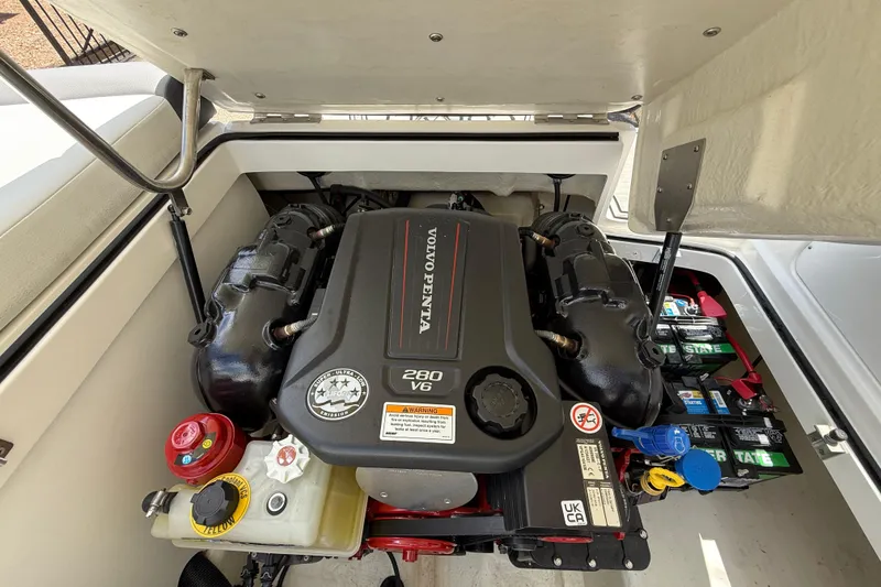Slide: The Image of 2024 Cobalt 220S boat engine compartment with Volvo Penta 280 V6 engine. - 17