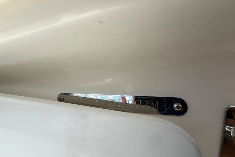 Slide: The Image of 2024 Cobalt 220S boat identification plate on white surface. - 18