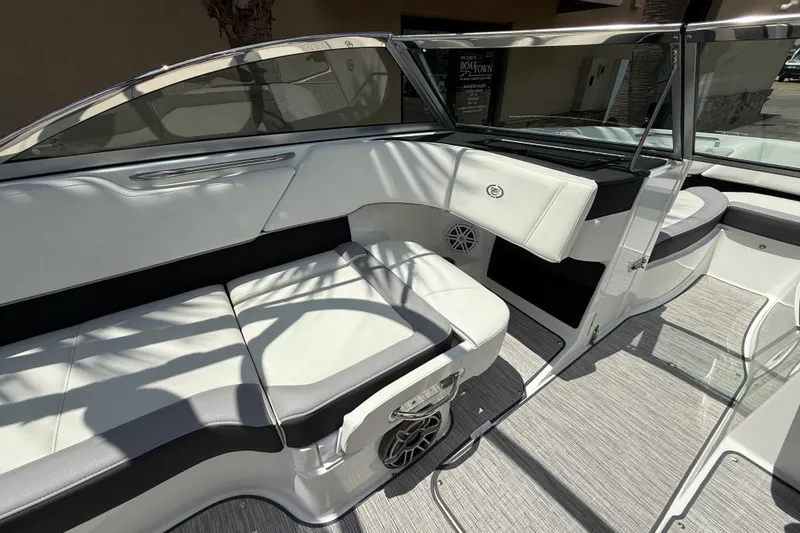 Slide: The Image of 2024 Cobalt 220S boat interior with white seating and modern design. - 9