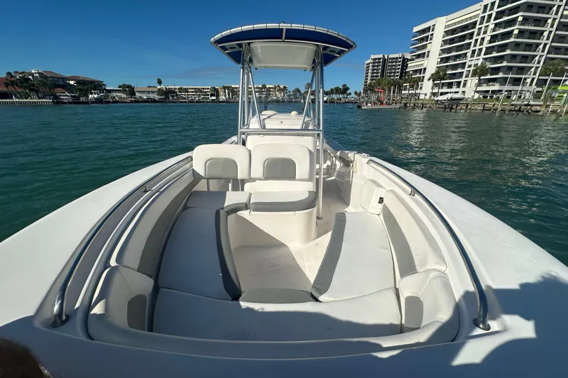 Slide: The Image of 2018 Tidewater 232 LXF boat on water, featuring spacious seating and modern design. - 3