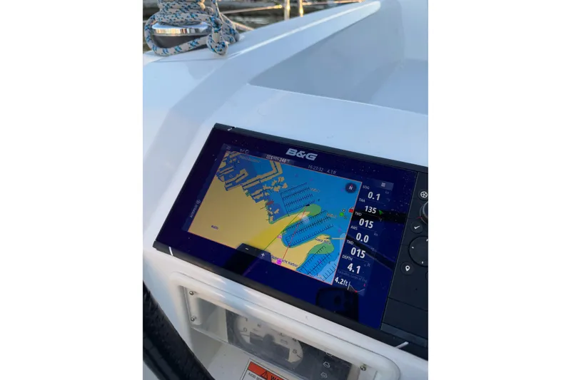 Slide: The Image of Navigation display on 2014 Beneteau 38 sailboat, showing digital map and data. - 14