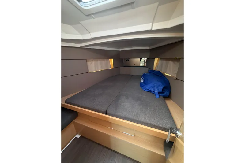 Slide: The Image of Interior cabin of 2014 Beneteau 38 sailboat with cozy bed and storage. - 3