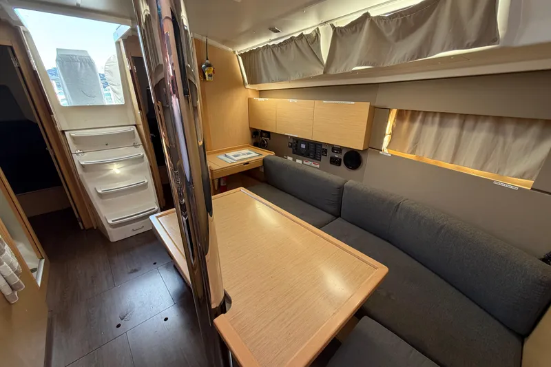 Slide: The Image of Interior of 2014 Beneteau 38 yacht with cozy seating and modern design. - 4