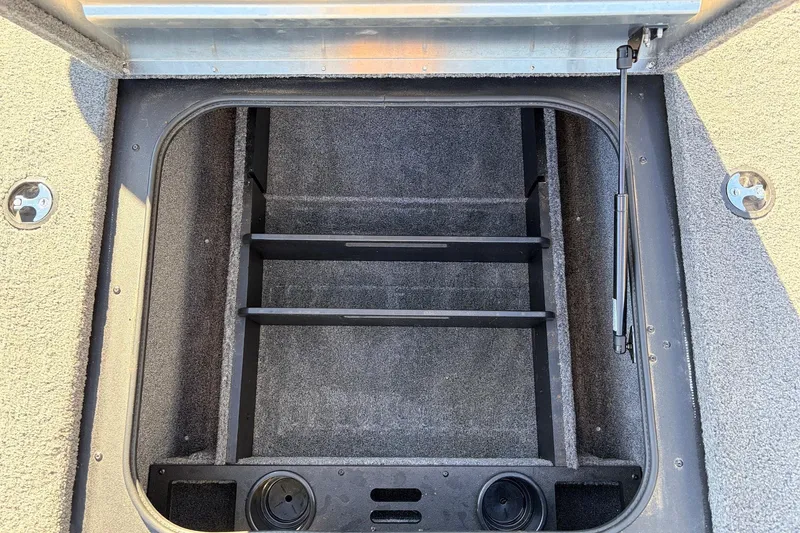 Slide: The Image of 2024 Tracker Pro Team 175 TXW boat storage compartment with organized interior layout. - 19
