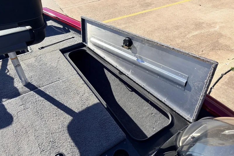 Slide: The Image of 2024 Tracker Pro Team 175 TXW boat storage compartment open on deck. - 21
