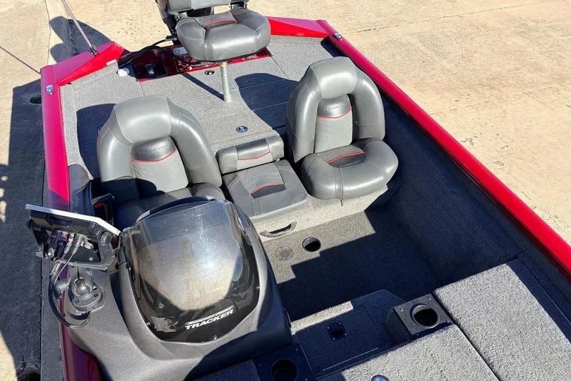 Slide: The Image of 2024 Tracker Pro Team 175 TXW boat interior with gray seating and red accents. - 25