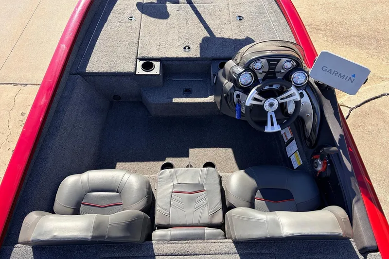 Slide: The Image of 2024 Tracker Pro Team 175 TXW boat interior with Garmin navigation system and dual seats. - 26