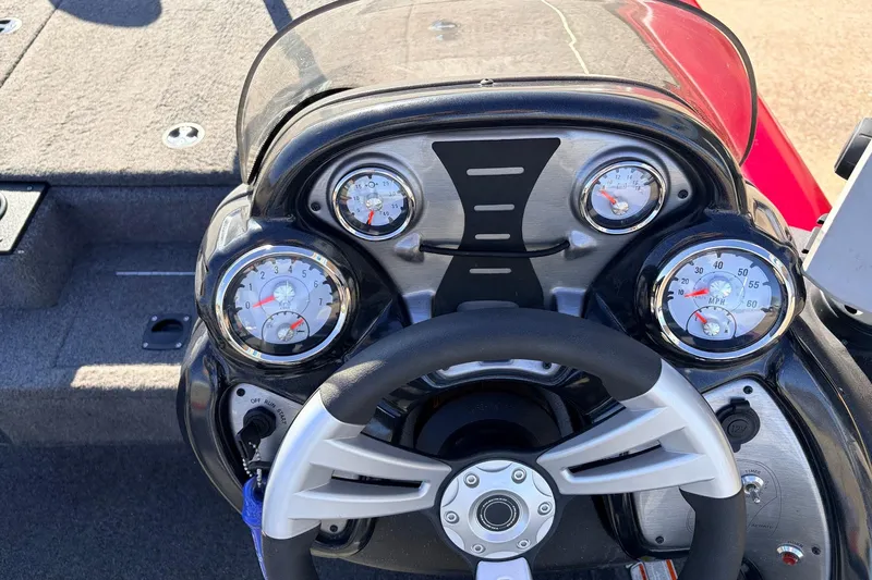 Slide: The Image of 2024 Tracker Pro Team 175 TXW boat dashboard with steering wheel and gauges. - 29